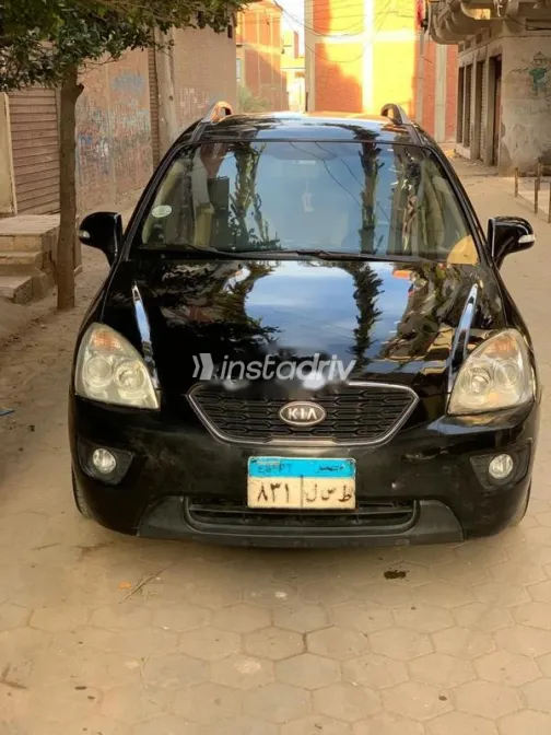 كيا كارينز 2012 أسود مستعملة للبيع - 1