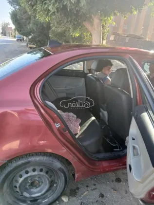 ميتسوبيشي لانسر اى اكس شارك 2015 أحمر مستعملة للبيع