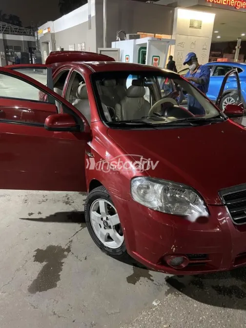 شيفروليه افيو 2006 أحمر غامق مستعملة للبيع - 1