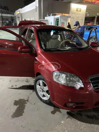 شيفروليه افيو 2006 أحمر غامق مستعملة للبيع