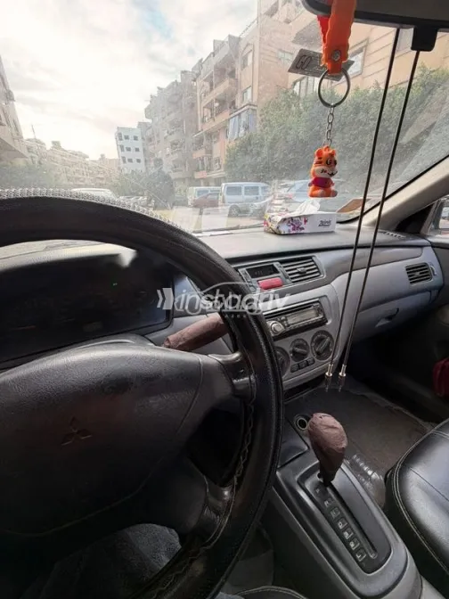 ميتسوبيشي لانسر 2006 فضي مستعملة للبيع - 4