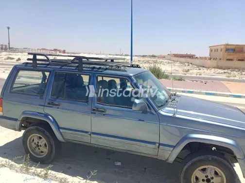 جيب شيروكي 1998 رمادي غامق مستعملة للبيع - 4