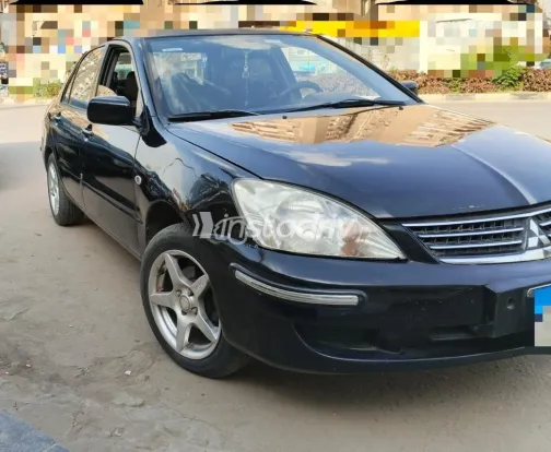 ميتسوبيشي لانسر بومة 2013 أسود مستعملة للبيع - 1