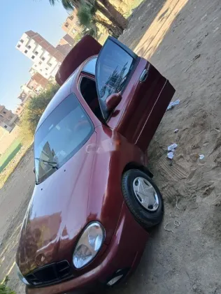 دايو لانوس 2005 أحمر مستعملة للبيع