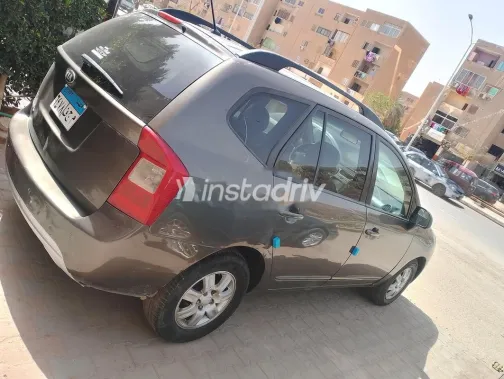 كيا كارينز 2010 بني مستعملة للبيع - 4