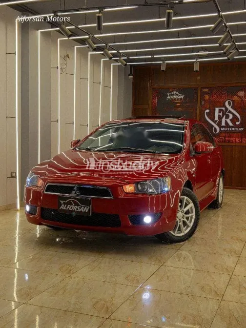 ميتسوبيشي لانسر 2015 أحمر غامق مستعملة للبيع - 1