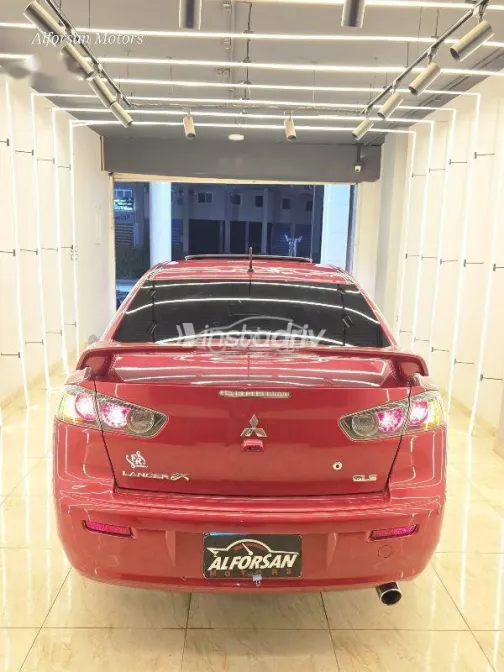 ميتسوبيشي لانسر 2015 أحمر غامق مستعملة للبيع - 3