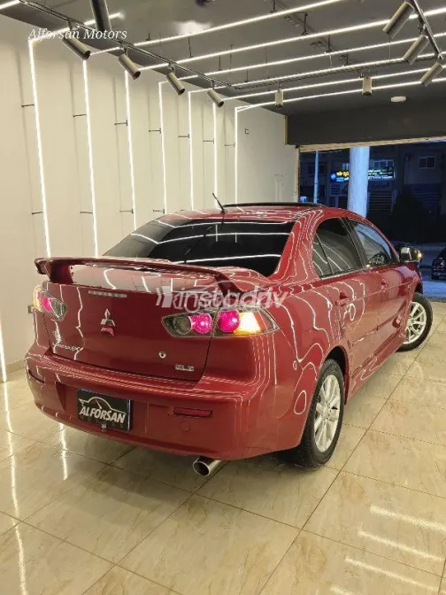 ميتسوبيشي لانسر 2015 أحمر غامق مستعملة للبيع - 4