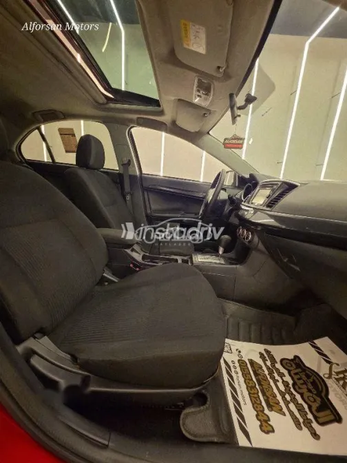 ميتسوبيشي لانسر 2015 أحمر غامق مستعملة للبيع - 8