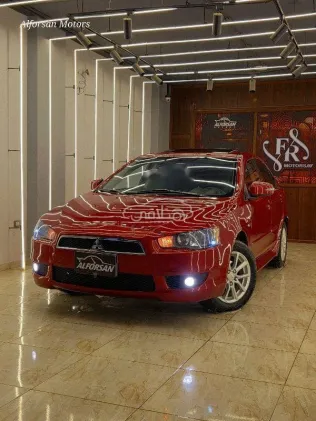 ميتسوبيشي لانسر 2015 أحمر غامق مستعملة للبيع