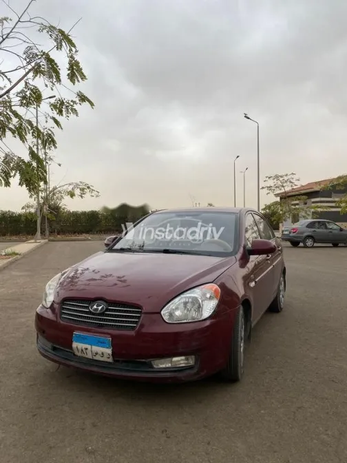 هيونداي اكسنت 2009 أحمر غامق مستعملة للبيع - 1
