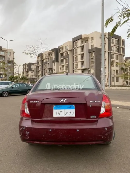 هيونداي اكسنت 2009 أحمر غامق مستعملة للبيع - 5