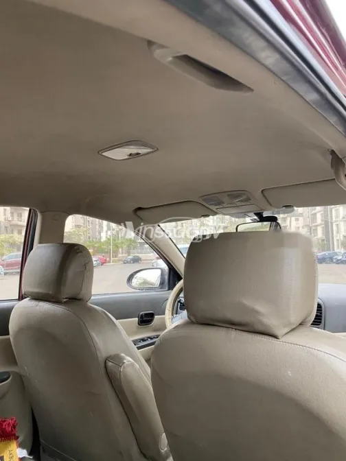 هيونداي اكسنت 2009 أحمر غامق مستعملة للبيع - 6