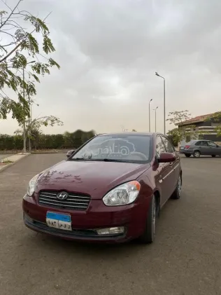 هيونداي اكسنت 2009 أحمر غامق مستعملة للبيع