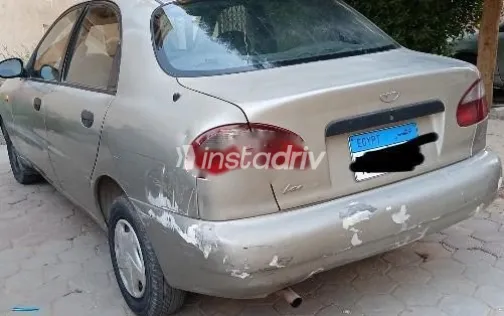 دايو لانوس 1999 ذهبي مستعملة للبيع - 6