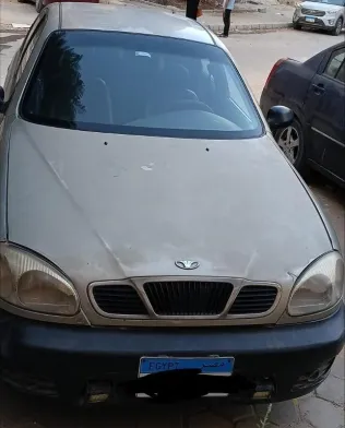 دايو لانوس 1999 ذهبي مستعملة للبيع