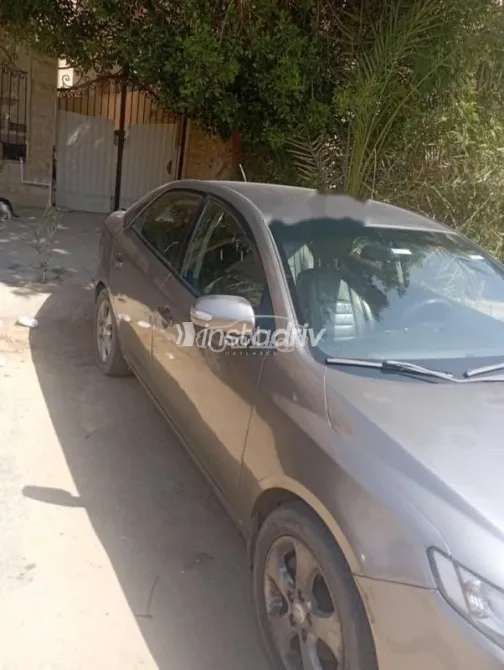 كيا سيراتو 2010 رمادي غامق مستعملة للبيع - 1