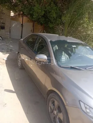 كيا سيراتو 2010 رمادي غامق مستعملة للبيع