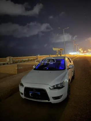 ميتسوبيشي لانسر اى اكس شارك 2016 أبيض مستعملة للبيع