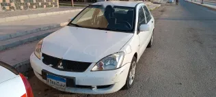 ميتسوبيشي لانسر 2007 أبيض مستعملة للبيع