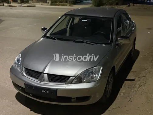 ميتسوبيشي لانسر 2010 ذهبي مستعملة للبيع - 1