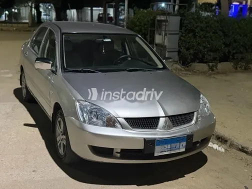 ميتسوبيشي لانسر 2010 ذهبي مستعملة للبيع - 2