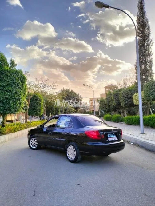 كيا ريو 2002 أسود مستعملة للبيع - 1