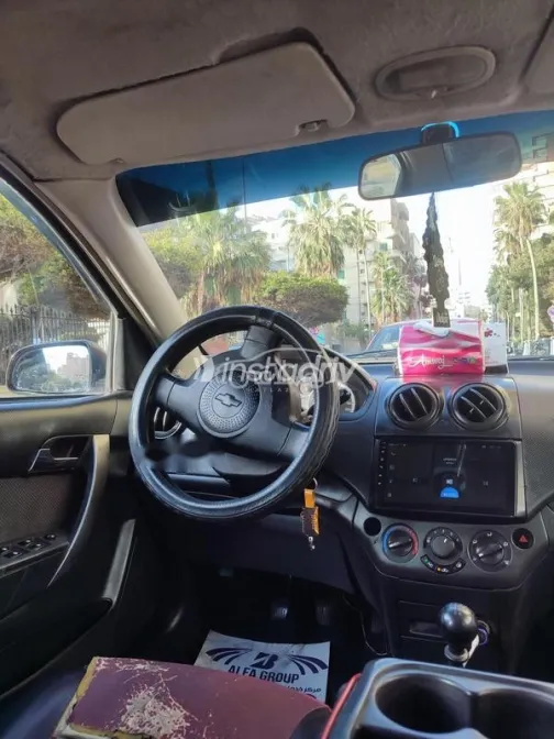 شيفروليه افيو 2011 أحمر غامق مستعملة للبيع - 5