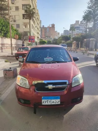 شيفروليه افيو 2011 أحمر غامق مستعملة للبيع