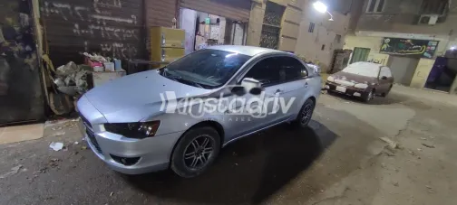 ميتسوبيشي لانسر اى اكس شارك 2014 فضي مستعملة للبيع - 1