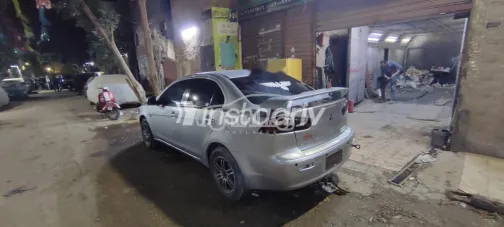 ميتسوبيشي لانسر اى اكس شارك 2014 فضي مستعملة للبيع - 2