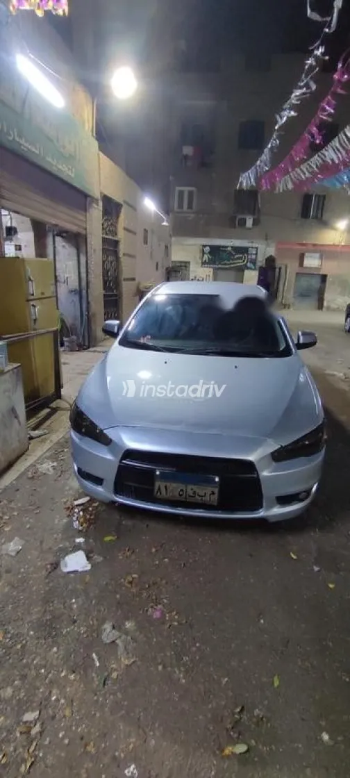 ميتسوبيشي لانسر اى اكس شارك 2014 فضي مستعملة للبيع - 3