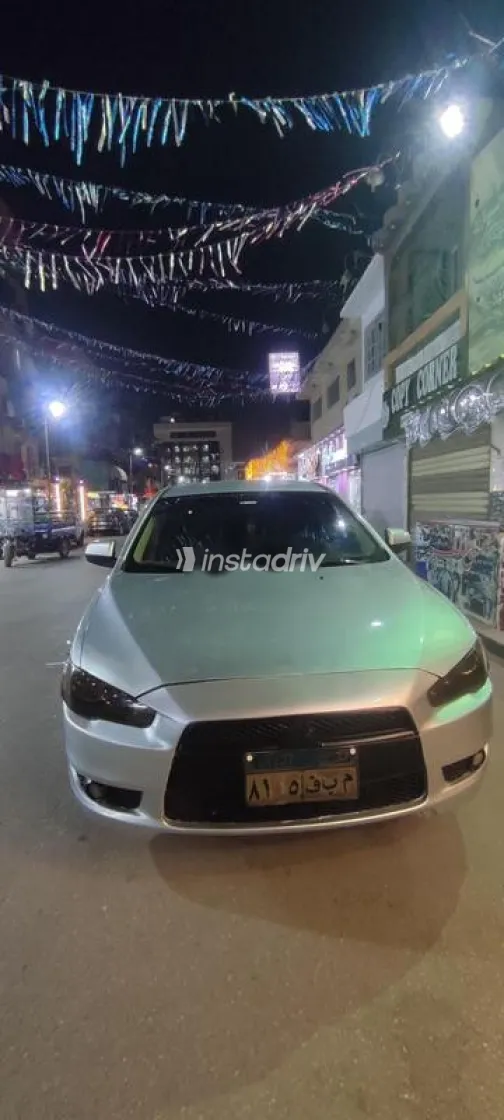 ميتسوبيشي لانسر اى اكس شارك 2014 فضي مستعملة للبيع - 4