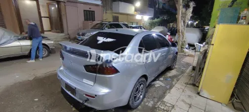 ميتسوبيشي لانسر اى اكس شارك 2014 فضي مستعملة للبيع - 5