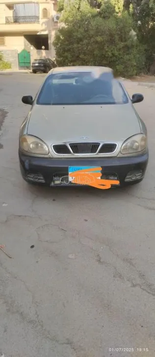 دايو لانوس 1999 ذهبي مستعملة للبيع