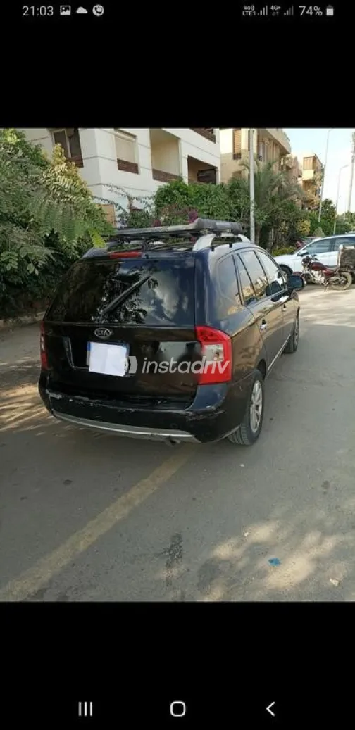 كيا كارينز 2012 أسود مستعملة للبيع - 1