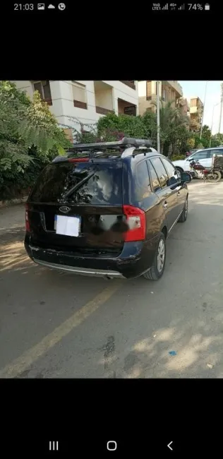 كيا كارينز 2012 أسود مستعملة للبيع