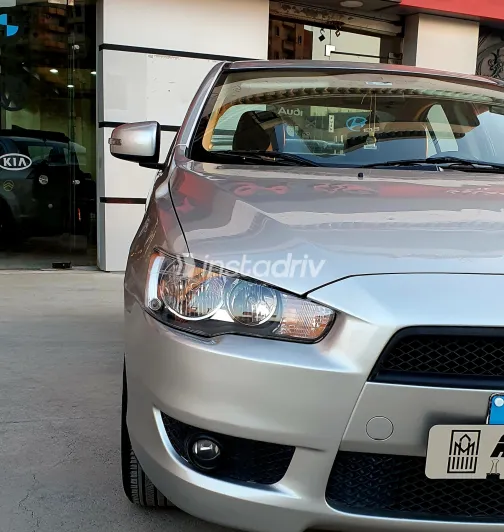 ميتسوبيشي لانسر 2016 أبيض مستعملة للبيع - 1