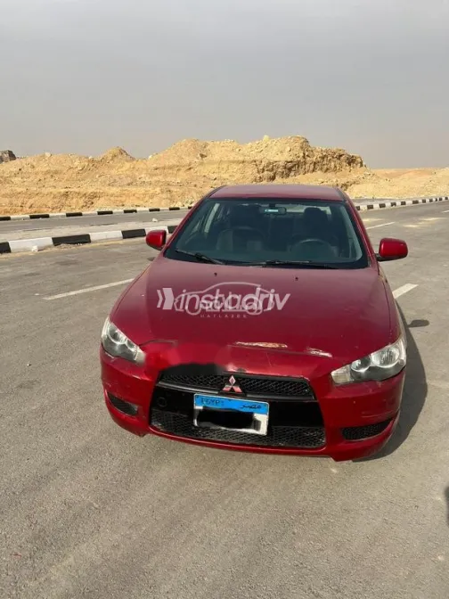 ميتسوبيشي لانسر اى اكس شارك 2009 أحمر غامق مستعملة للبيع - 3