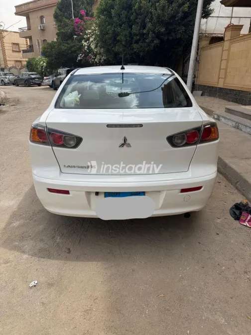 ميتسوبيشي لانسر 2015 أبيض مستعملة للبيع - 4