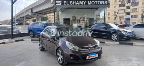 كيا ريو 2015 بني مستعملة للبيع - 1