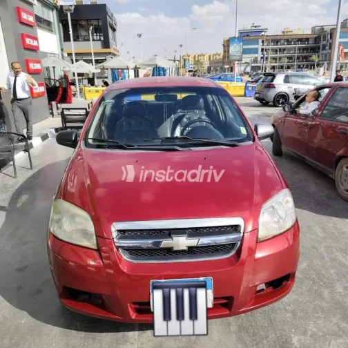 شيفروليه افيو 2009 أحمر غامق مستعملة للبيع - 1