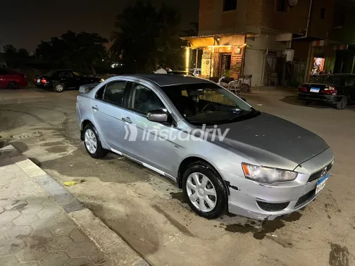 ميتسوبيشي لانسر 2015 أبيض مستعملة للبيع - 1