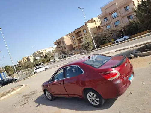 شيفروليه أوبترا 2015 أحمر غامق مستعملة للبيع - 2