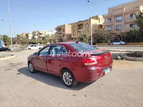 شيفروليه أوبترا 2015 أحمر غامق مستعملة للبيع - 3