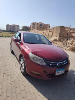 شيفروليه أوبترا 2015 أحمر غامق مستعملة للبيع