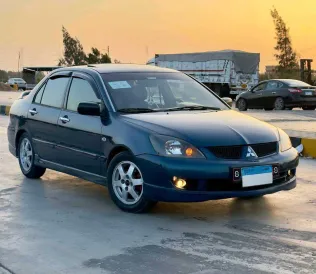 ميتسوبيشي لانسر 2007 أبيض مستعملة للبيع