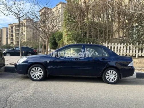 ميتسوبيشي لانسر بومة 2013 أزرق غامق مستعملة للبيع - 1