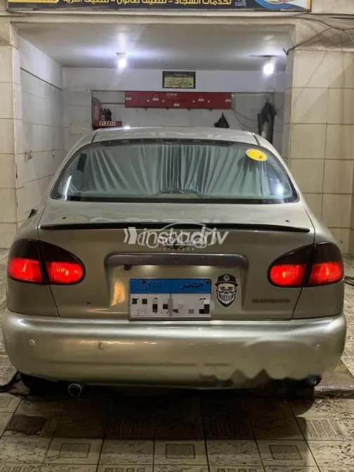 دايو لانوس 1999 ذهبي مستعملة للبيع - 2