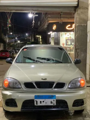 دايو لانوس 1999 ذهبي مستعملة للبيع